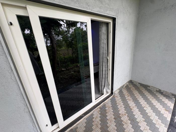 Tiled patio outside a sliding glass door at the Nandai Gate stay.